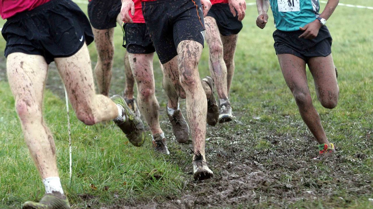 cross country runners with cross country shoes on