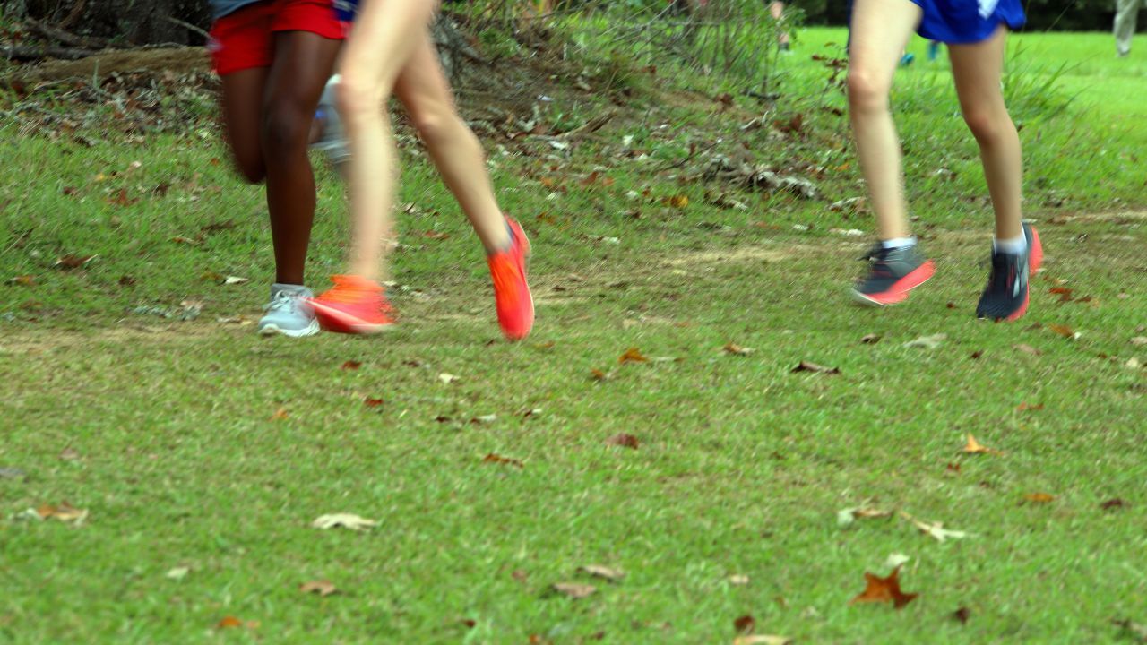 cross country runners with cross country shoes on