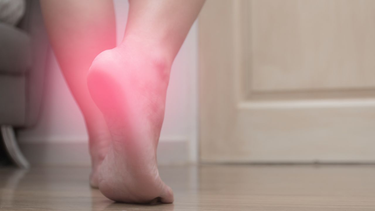 A person with plantar fasciitis pain in their heel