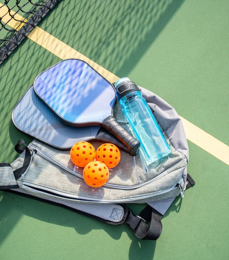 How Do I Choose A Pickleball Bag-A pickleball bag, balls and water bottle